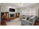 Cozy living room with fireplace, hardwood floors, and ample natural light at 2995 Boulder Walk Se Ct, Atlanta, GA 30316