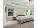 Spacious main bedroom with ample natural light, tray ceiling, and neutral color palette at 2995 Boulder Walk Se Ct, Atlanta, GA 30316
