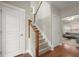 A staircase with wood handrail, hardwood floors and natural light at 2995 Boulder Walk Se Ct, Atlanta, GA 30316