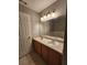 Bathroom vanity featuring double sinks and wood cabinets with ample storage at 3777 Harvest Dr, Decatur, GA 30034