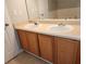 Well-lit bathroom vanity featuring double sinks with wood cabinets and plenty of counter space at 3777 Harvest Dr, Decatur, GA 30034