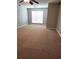 Spacious bedroom with neutral carpet, ceiling fan and a large window at 3777 Harvest Dr, Decatur, GA 30034
