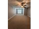 Spacious bedroom with neutral walls, carpet flooring, a ceiling fan, and window at 3777 Harvest Dr, Decatur, GA 30034