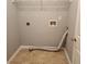 Functional laundry room with hookups, overhead shelving, and neutral tones offers convenience at 3777 Harvest Dr, Decatur, GA 30034