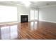 Bright living room with hardwood floors, fireplace, and access to the outdoor space at 3777 Harvest Dr, Decatur, GA 30034