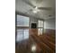 Living room with hardwood floors, fireplace and a ceiling fan with lights at 3777 Harvest Dr, Decatur, GA 30034