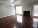 Living room with hardwood floors, fireplace, a window, and access to the outdoor space at 3777 Harvest Dr, Decatur, GA 30034
