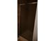 Shower stall with sleek sliding glass door with dark tile accents at 3777 Harvest Dr, Decatur, GA 30034