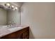 Bathroom featuring a granite countertop, stylish sink and vanity, and modern lighting at 6593 Sleepy Hollow Ln, Morrow, GA 30260