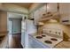 Well-equipped kitchen with white cabinets, stove, and refrigerator at 6593 Sleepy Hollow Ln, Morrow, GA 30260