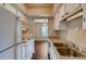 Efficient kitchen with white appliances, ample counter space and a view of the dining area at 6593 Sleepy Hollow Ln, Morrow, GA 30260