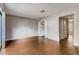Bright living room with hardwood floors, ample closet space, and neutral paint at 6593 Sleepy Hollow Ln, Morrow, GA 30260