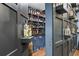 Basement bar with wooden barrel, ample shelving, and custom features for stylish entertaining at 101 Fernwood Dr, Woodstock, GA 30188