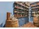 Basement bar area with wood countertop, ample shelving, and custom features for stylish entertaining at 101 Fernwood Dr, Woodstock, GA 30188