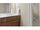 Bathroom with a single vanity, mirror, and partial view into the toilet room at 101 Fernwood Dr, Woodstock, GA 30188