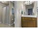 Bathroom featuring a shower with curtain and a single sink vanity with mirror at 101 Fernwood Dr, Woodstock, GA 30188