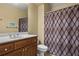 Neutral bathroom featuring vanity and shower with decorative curtain at 101 Fernwood Dr, Woodstock, GA 30188