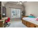 Bedroom with vaulted ceiling, desk area, and a bed with storage drawers at 101 Fernwood Dr, Woodstock, GA 30188