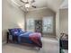 Bedroom with vaulted ceilings, ceiling fan, and large windows with shutters at 101 Fernwood Dr, Woodstock, GA 30188
