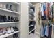 Walk-in closet features shelving for shoes, folded items, and clothing rack at 101 Fernwood Dr, Woodstock, GA 30188