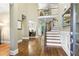 Grand two-story foyer with hardwood floors, elegant staircase, and natural light at 101 Fernwood Dr, Woodstock, GA 30188