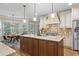 Open kitchen with stainless steel appliances, granite counters, a central island, and a breakfast nook at 101 Fernwood Dr, Woodstock, GA 30188
