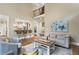 Comfortable living room featuring hardwood floors, high ceilings, and seamless connection to the modern kitchen at 101 Fernwood Dr, Woodstock, GA 30188