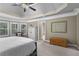 Spacious main bedroom with bay window, closet with white cabinet, and access to the ensuite bath at 101 Fernwood Dr, Woodstock, GA 30188
