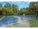 Community tennis court perfect for enjoying a match with friends and Gathering at 101 Fernwood Dr, Woodstock, GA 30188