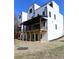 Two-story home backyard with a deck and patio, perfect for entertaining at 1420 Coretta Bend, Atlanta, GA 30318