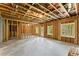 Unfinished basement framed and ready for customization; features windows and door at 1420 Coretta Bnd, Atlanta, GA 30318