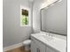 Bathroom showcasing a modern vanity, mirror, and fixtures at 1420 Coretta Bnd, Atlanta, GA 30318