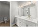 Stylish bathroom with double vanity, modern fixtures, and a large mirror for a luxurious feel at 1420 Coretta Bnd, Atlanta, GA 30318