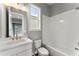 A cozy bathroom featuring a modern vanity with gold fixtures and a tub with white subway tiles at 1420 Coretta Bnd, Atlanta, GA 30318
