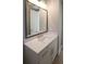 Bathroom featuring a stylish mirror above a white vanity with a modern faucet and hardware at 1420 Coretta Bend, Atlanta, GA 30318