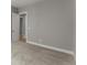 Bedroom with neutral carpeting, light gray walls, and views to another room through doorway at 1420 Coretta Bnd, Atlanta, GA 30318