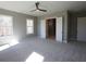 Spacious bedroom featuring plush carpeting, lots of windows, closet space, and a ceiling fan at 1420 Coretta Bend, Atlanta, GA 30318