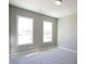 Bright bedroom featuring neutral walls, plush carpeting and two windows offering lots of natural light at 1420 Coretta Bend, Atlanta, GA 30318