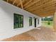 Finished basement exterior features painted brick, windows, and rear entrance at 1420 Coretta Bnd, Atlanta, GA 30318