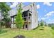 New townhome boasts covered deck, backyard, and bright white and gray exterior at 1420 Coretta Bnd, Atlanta, GA 30318