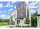 Modern home showcasing a two-story exterior with gray accents, painted brick, landscaping and a manicured lawn at 1420 Coretta Bnd, Atlanta, GA 30318