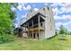 Townhome features a covered deck and backyard overlooking the lush green lawn at 1420 Coretta Bnd, Atlanta, GA 30318