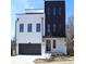 Modern two-story home featuring black trim, a gray garage door, and a neutral paint scheme at 1420 Coretta Bend, Atlanta, GA 30318