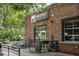 A cozy brewery with a brick exterior, a barrel and greenery at the entrance at 1420 Coretta Bend, Atlanta, GA 30318
