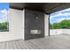 Outdoor fireplace clad in tile serves as a focal point of the spacious deck at 1420 Coretta Bnd, Atlanta, GA 30318