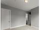 Spacious hallway with neutral carpeting, white doors, and easy access to other areas of the home at 1420 Coretta Bnd, Atlanta, GA 30318