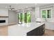 Modern kitchen boasts a large island, stainless steel appliances, and stylish pendant lighting fixtures at 1420 Coretta Bnd, Atlanta, GA 30318