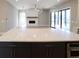 Open concept kitchen featuring white marble countertops, stainless steel appliances, and modern pendant lighting at 1420 Coretta Bend, Atlanta, GA 30318