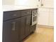 Kitchen island with gray cabinets, stainless steel oven, white countertops and hardwood flooring at 1420 Coretta Bend, Atlanta, GA 30318