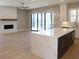 Beautiful kitchen with a white brick fireplace, large island, and stainless steel appliances at 1420 Coretta Bend, Atlanta, GA 30318